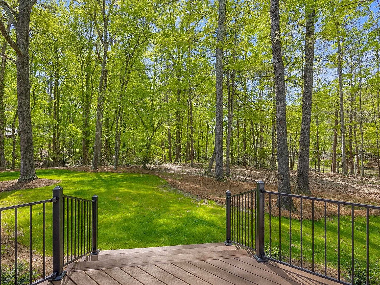 View from the back deck across the level grass yard down toward Lake Calhoun
